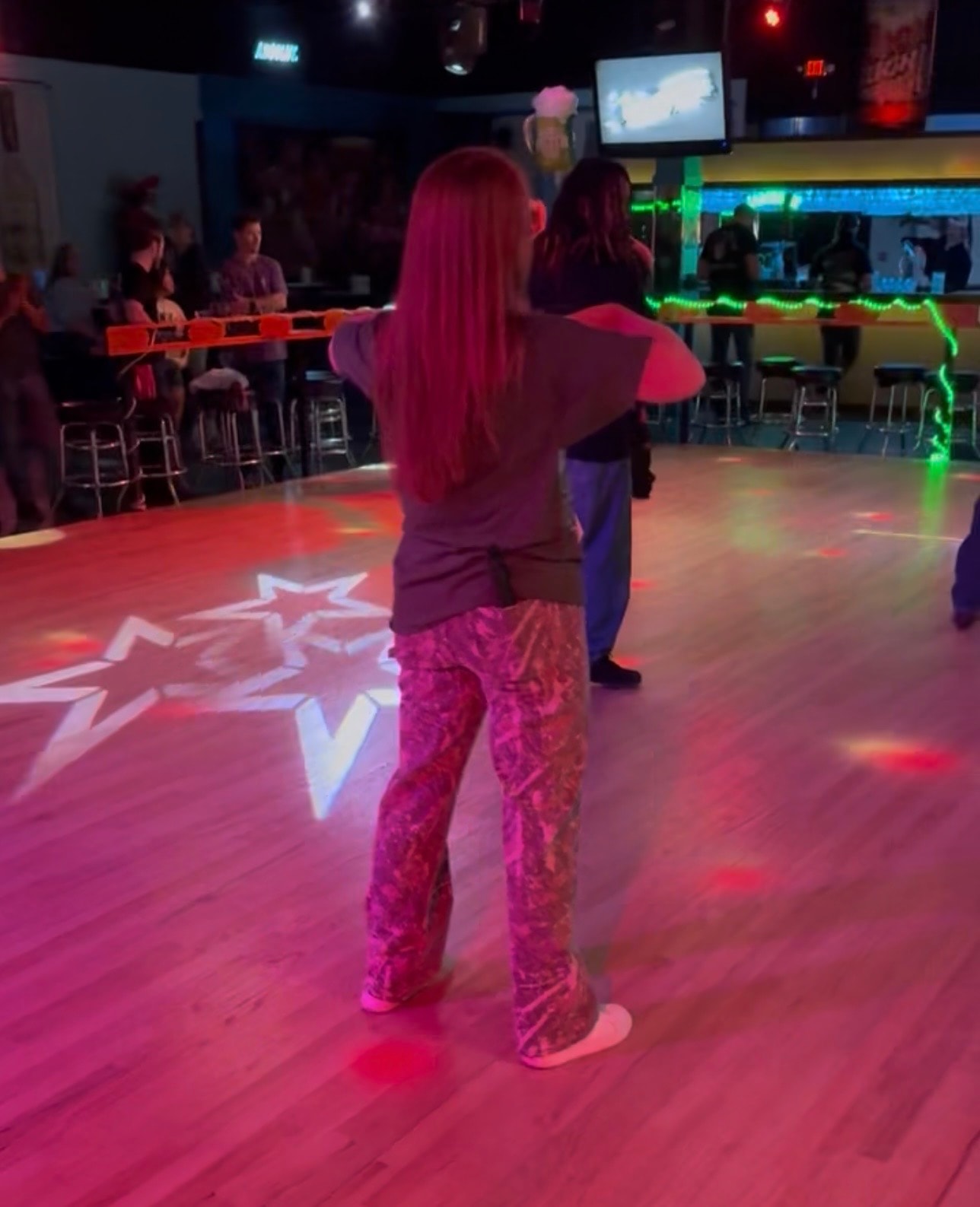 Rustic barn dance hall with warm evening lights